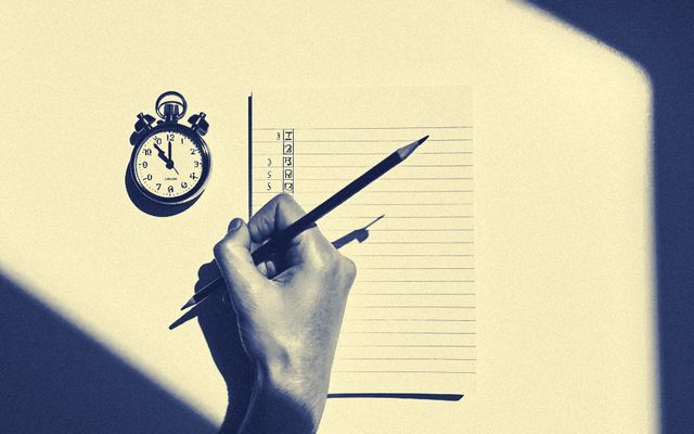 A hand making tally marks on a ruled pad beside a stopwatch.